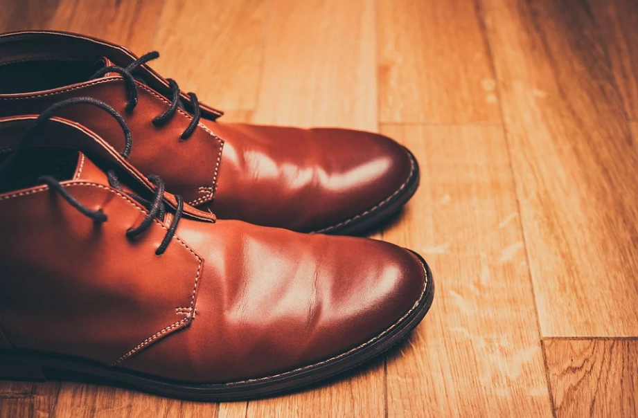 a pair of leather shoes on the floor